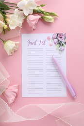 Guest list, pen, tulle fabric and beautiful flowers on pink background, flat lay. Space for text