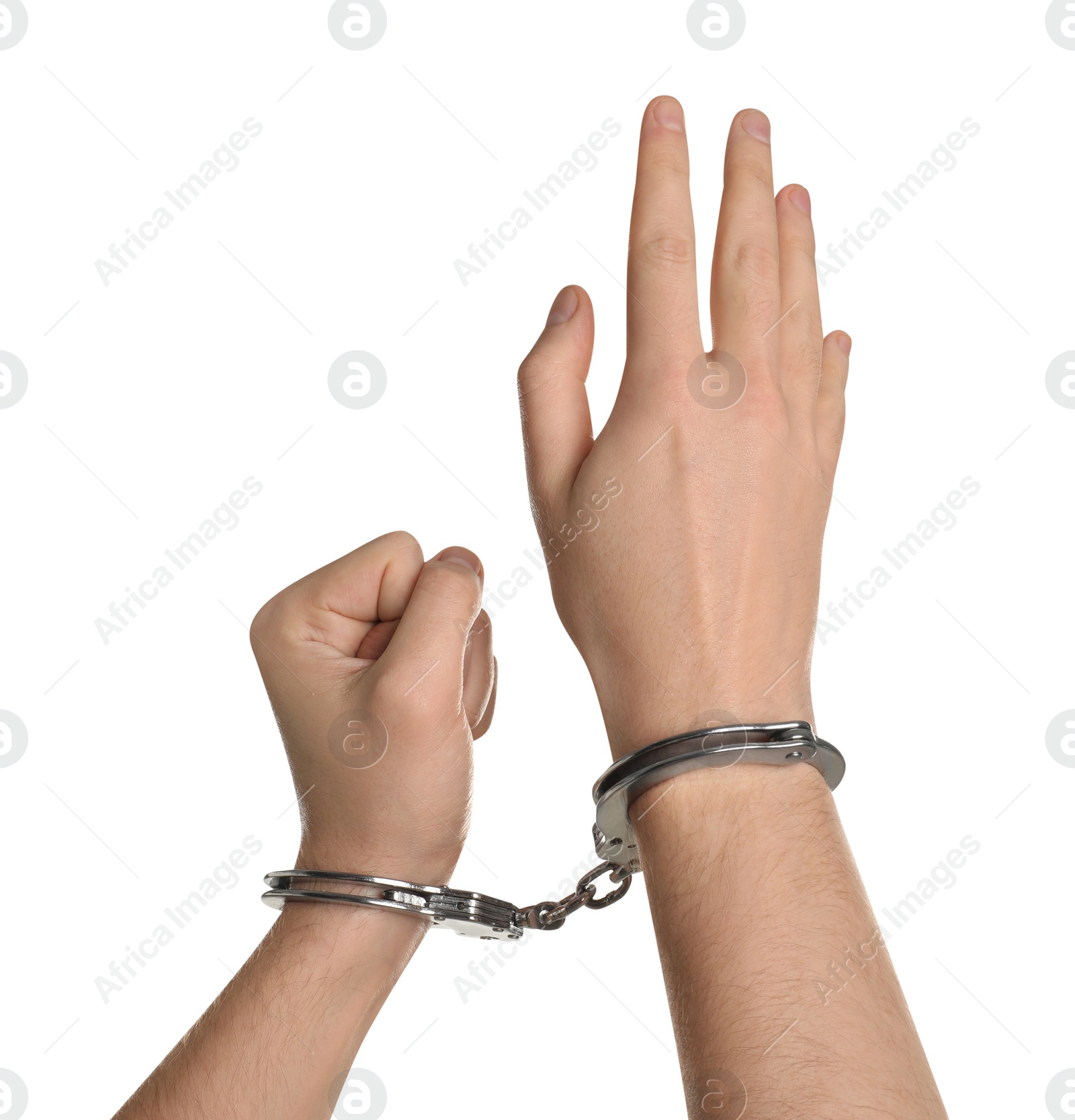 Photo of Freedom concept. Man with handcuffs on his hands against white background, closeup