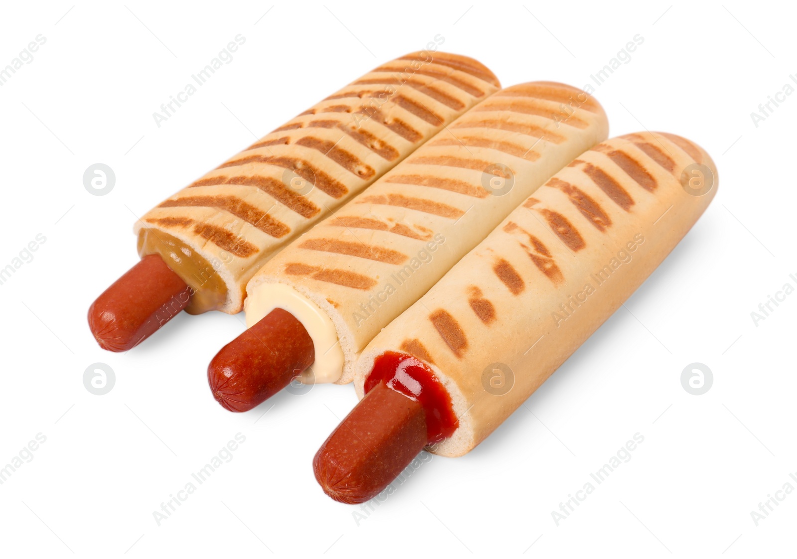 Photo of Tasty french hot dogs with different sauces on white background