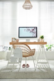 Photo of Stylish home office interior with comfortable workplace