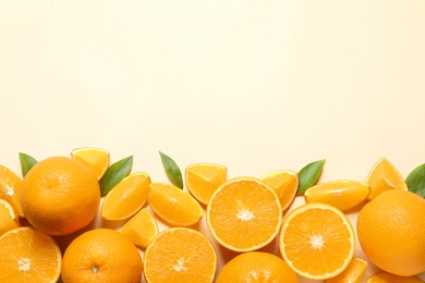 Photo of Flat lay composition with ripe oranges and space for text on color background