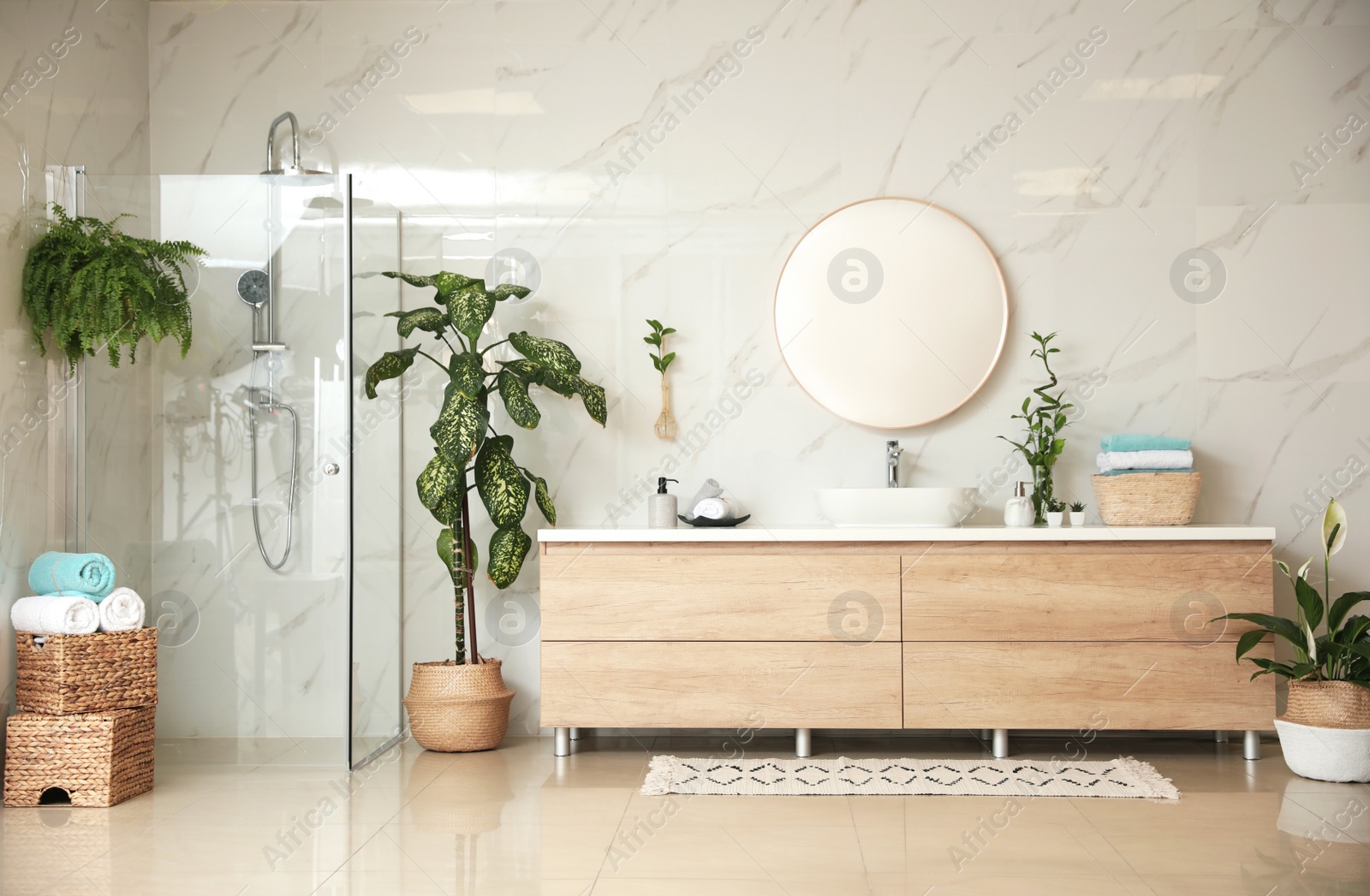 Photo of Green plants in elegant modern bathroom. Interior design