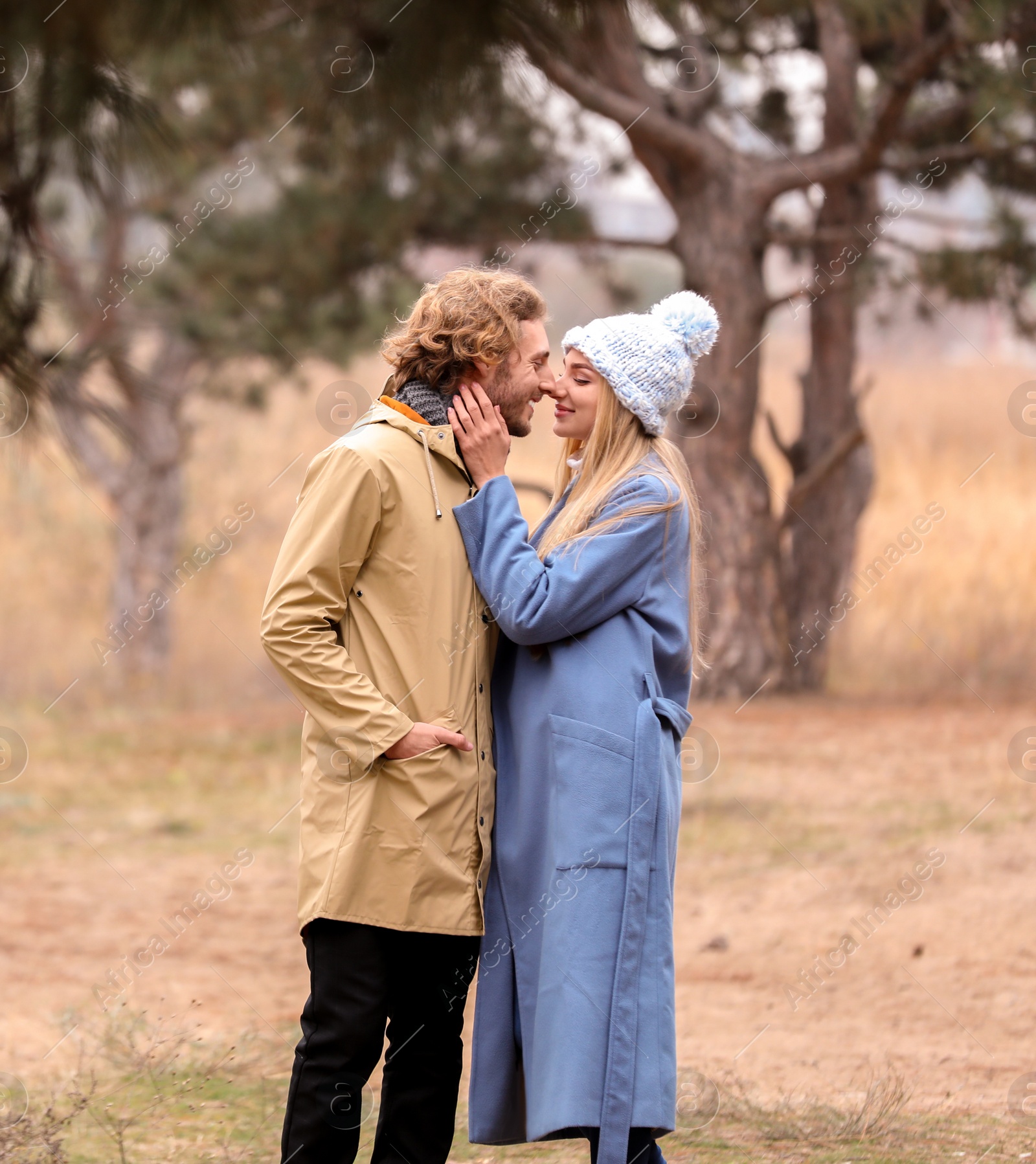 Photo of Young romantic couple in park on autumn day