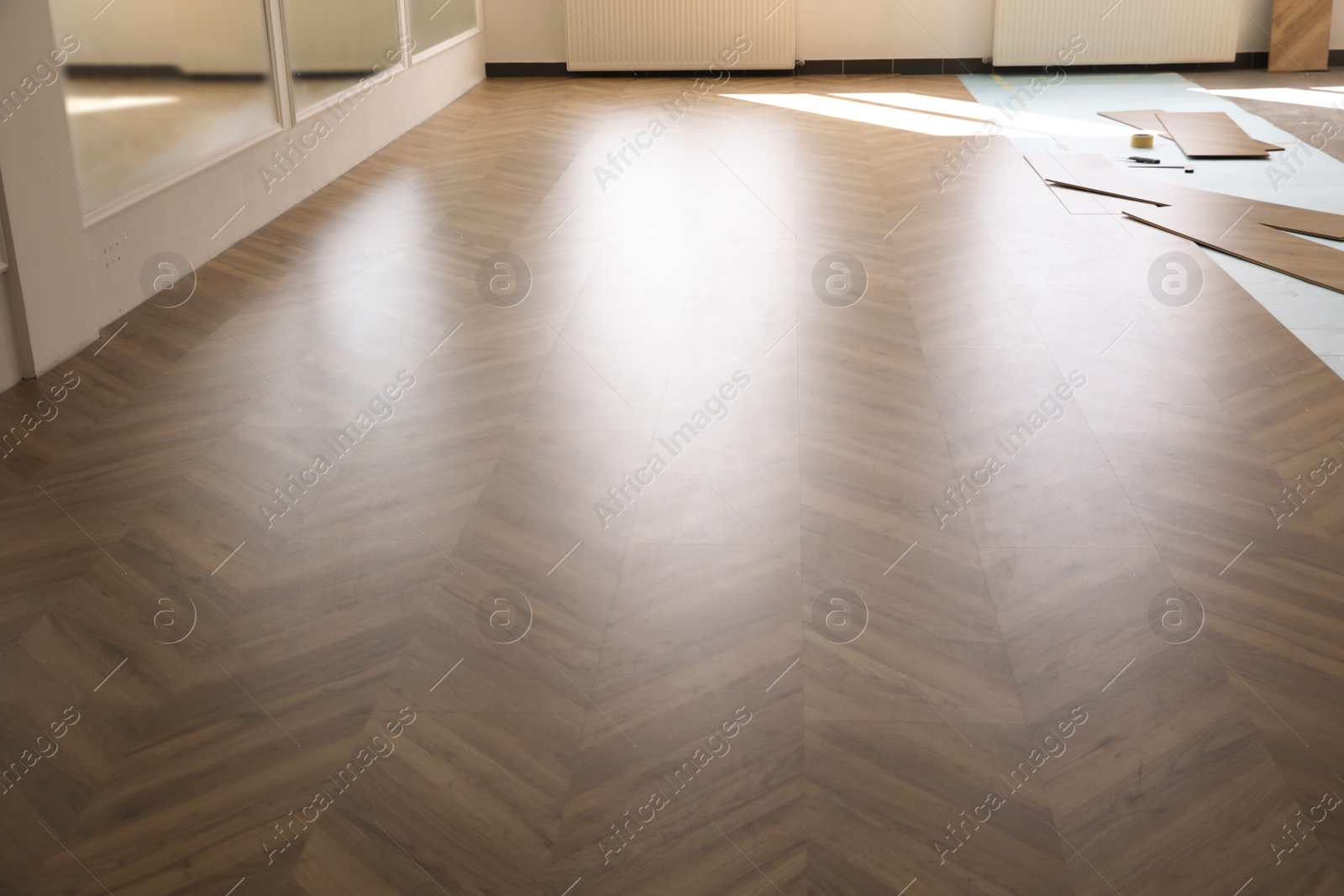 Photo of Installation of laminated wooden floor at home