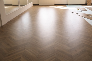 Photo of Installation of laminated wooden floor at home