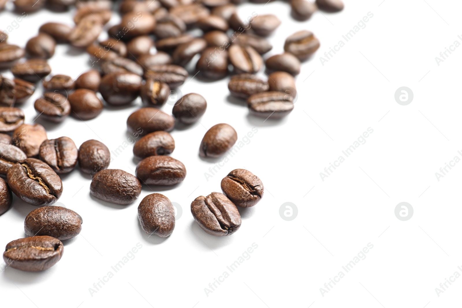 Photo of Roasted coffee beans on white background, closeup