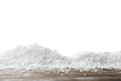 Wooden surface covered with snow against white background