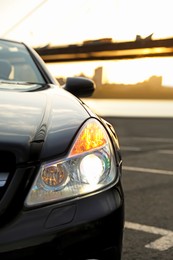 Luxury black convertible car outdoors, closeup view