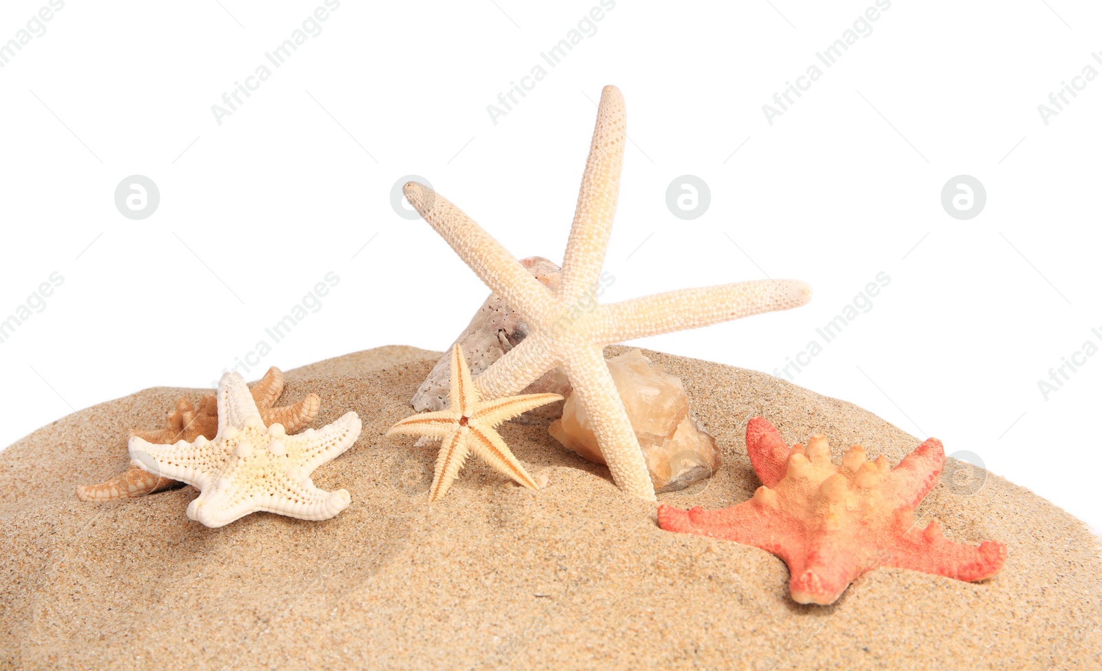 Photo of Sand with beautiful sea stars and stones isolated on white