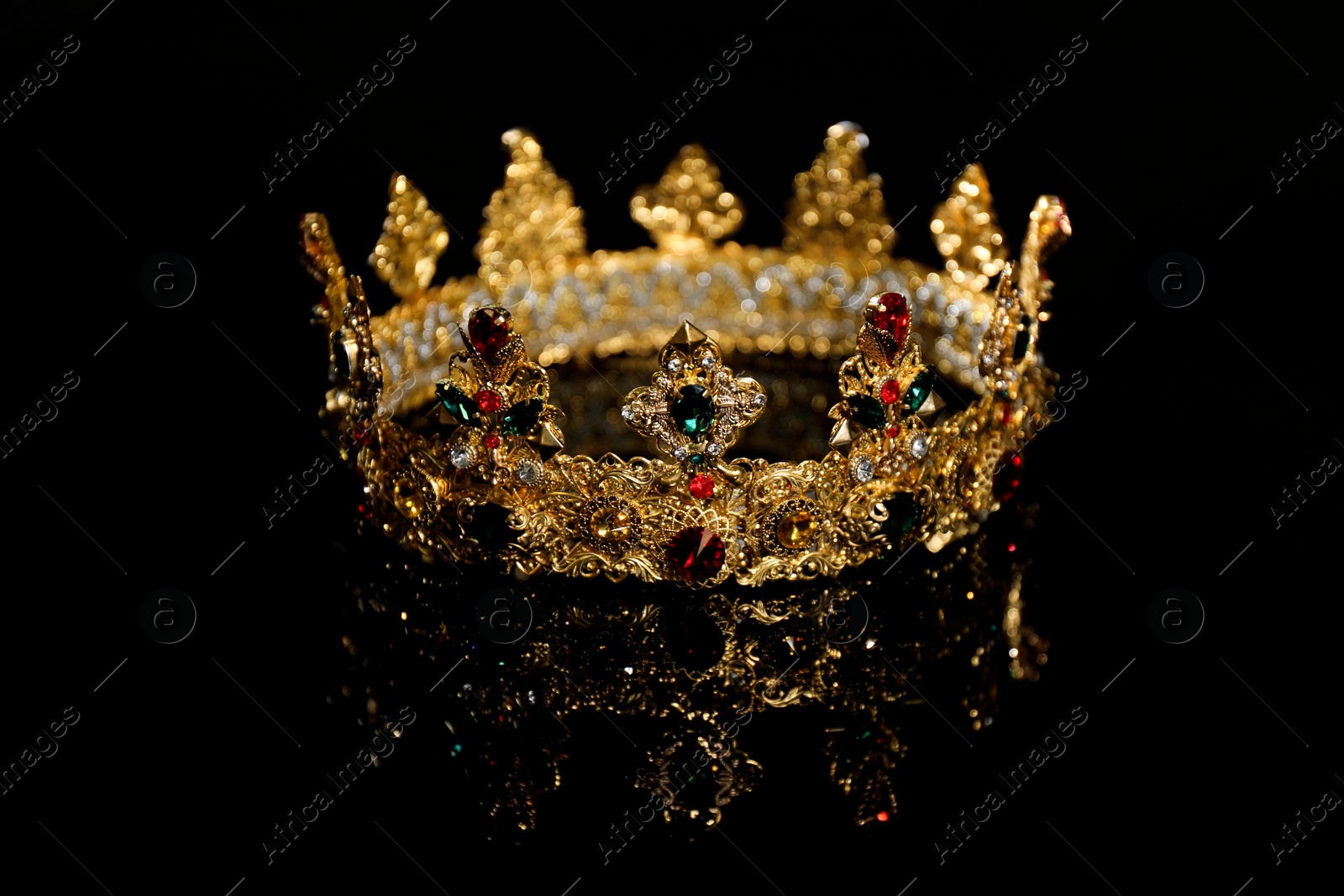 Photo of Beautiful golden crown on black background. Fantasy item