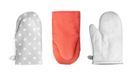 Image of Set with different oven gloves on white background, top view. Banner design