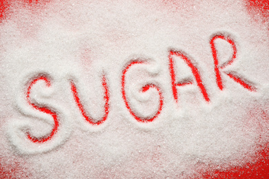 Composition with word SUGAR on red background, top view