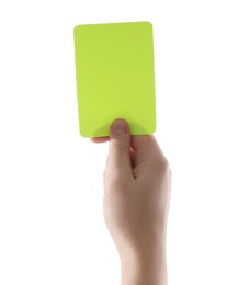 Photo of Referee holding yellow card on white background, closeup