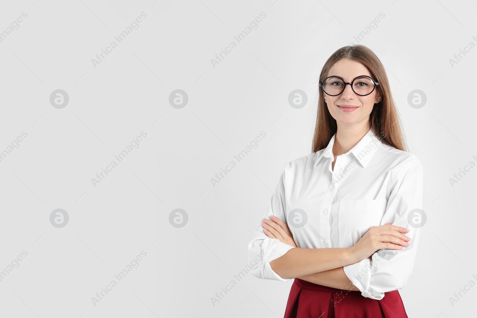 Photo of Portrait of beautiful young businesswoman on white background. Space for text