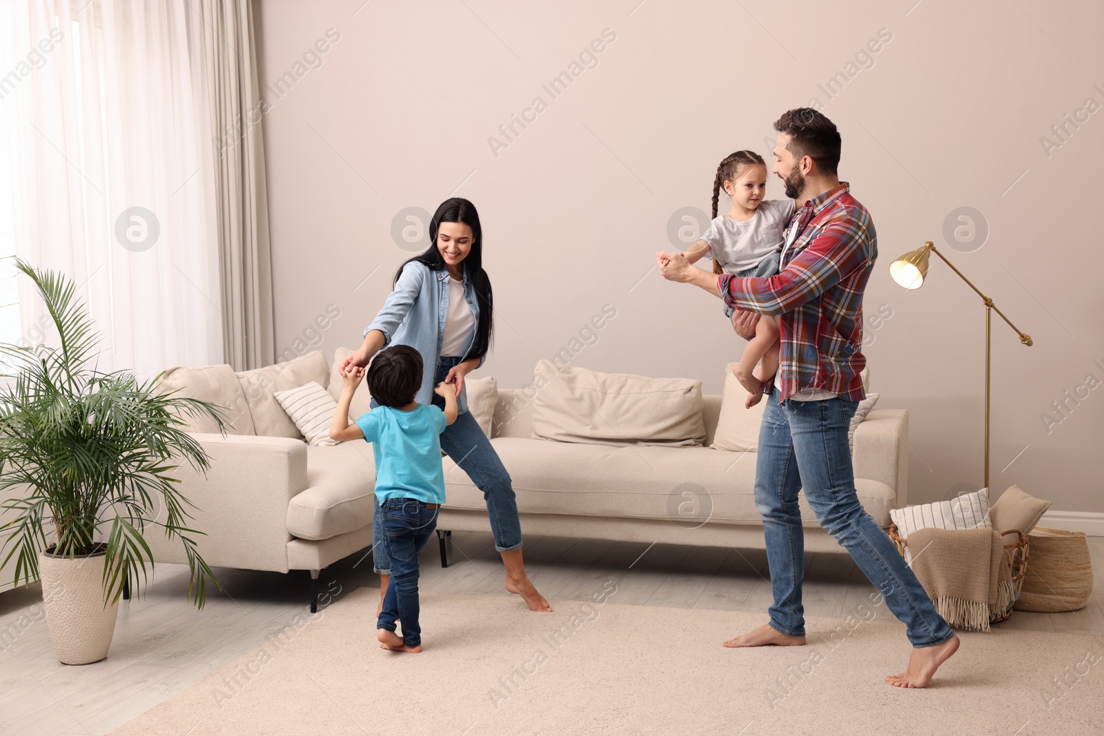 Photo of Happy family spending time together at home