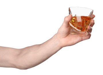 Man holding glass of whiskey with ice cubes on white background, closeup