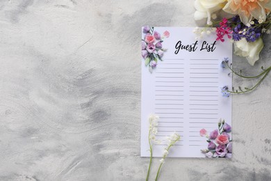 Guest list and beautiful flowers on light textured background, flat lay. Space for text