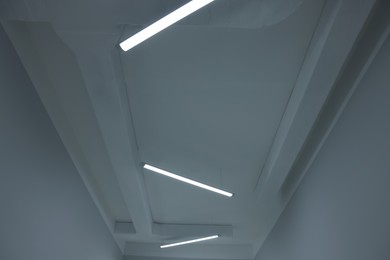 Photo of Ceiling with modern lights in renovated room