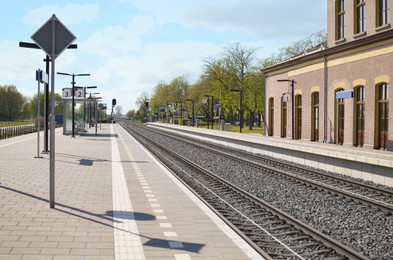 Photo of Empty platform of railway station on sunny day