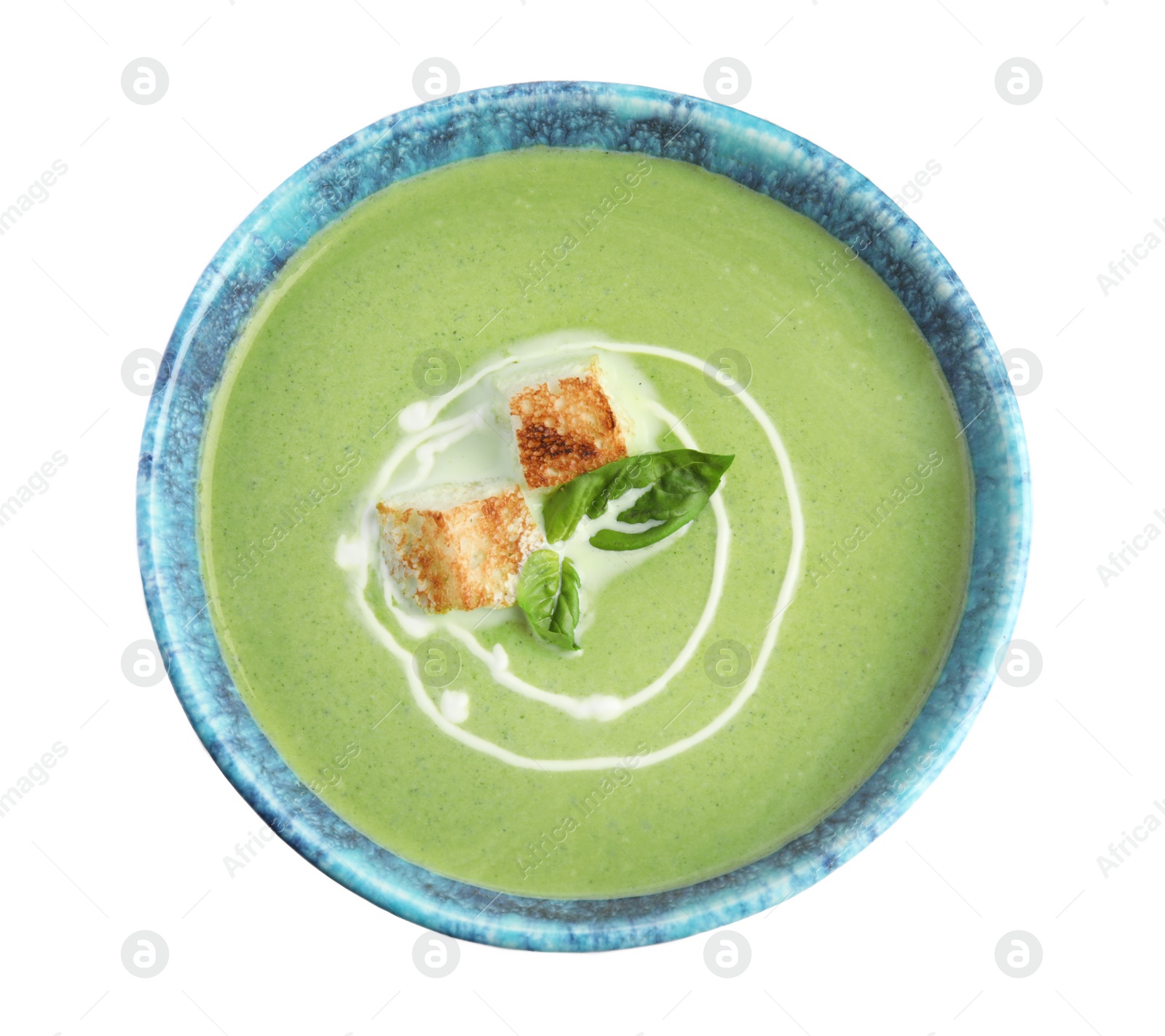 Photo of Delicious broccoli cream soup with croutons isolated on white, top view