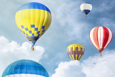 Image of Many bright hot air balloons flying in sky