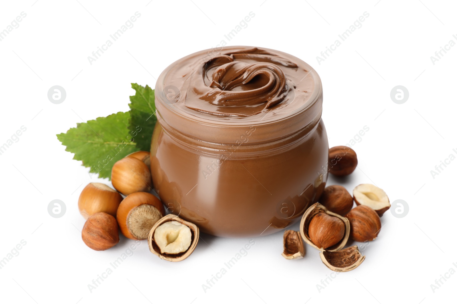 Photo of Glass jar with tasty chocolate hazelnut spread and nuts on white background