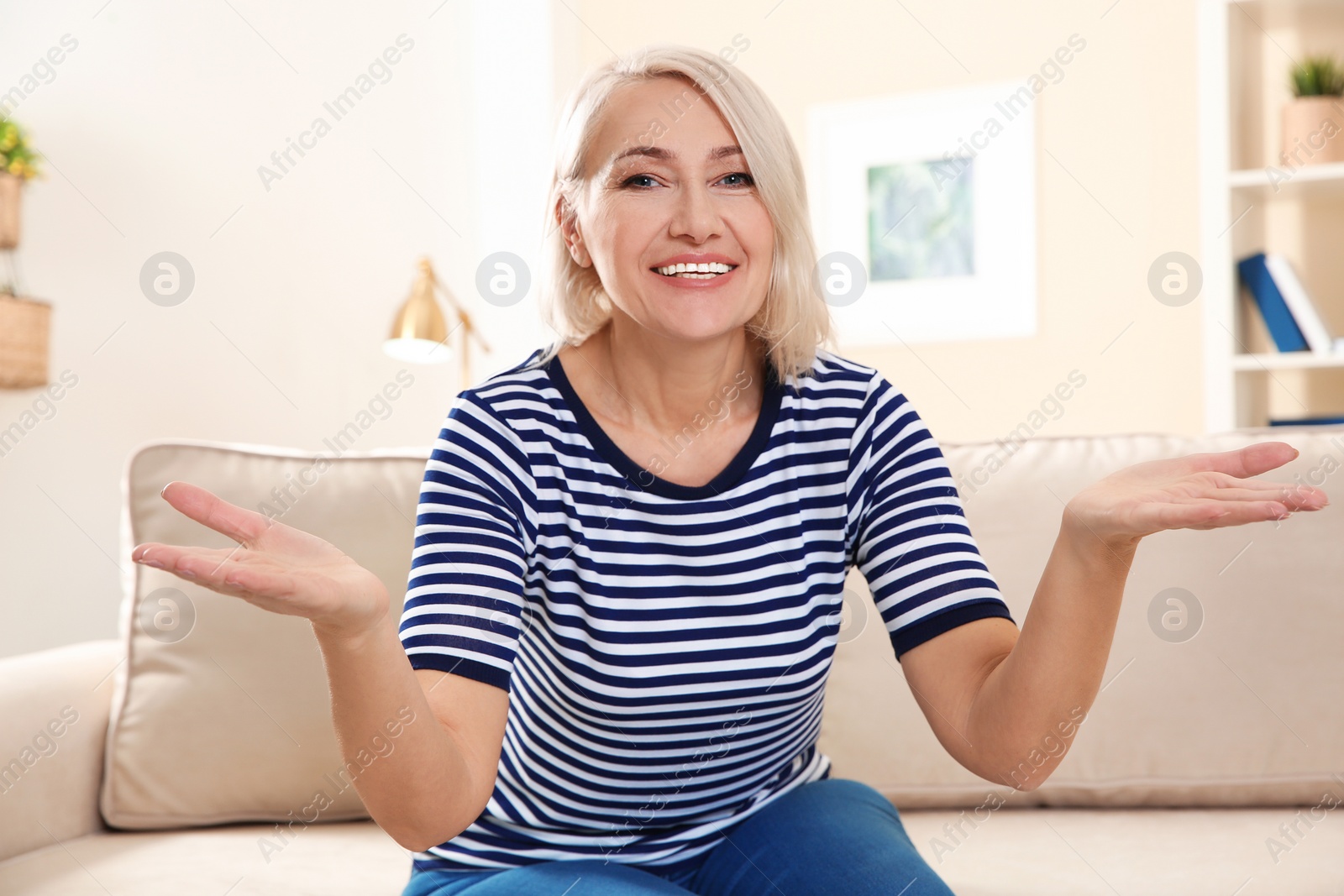 Photo of Mature woman using video chat at home, view from web camera