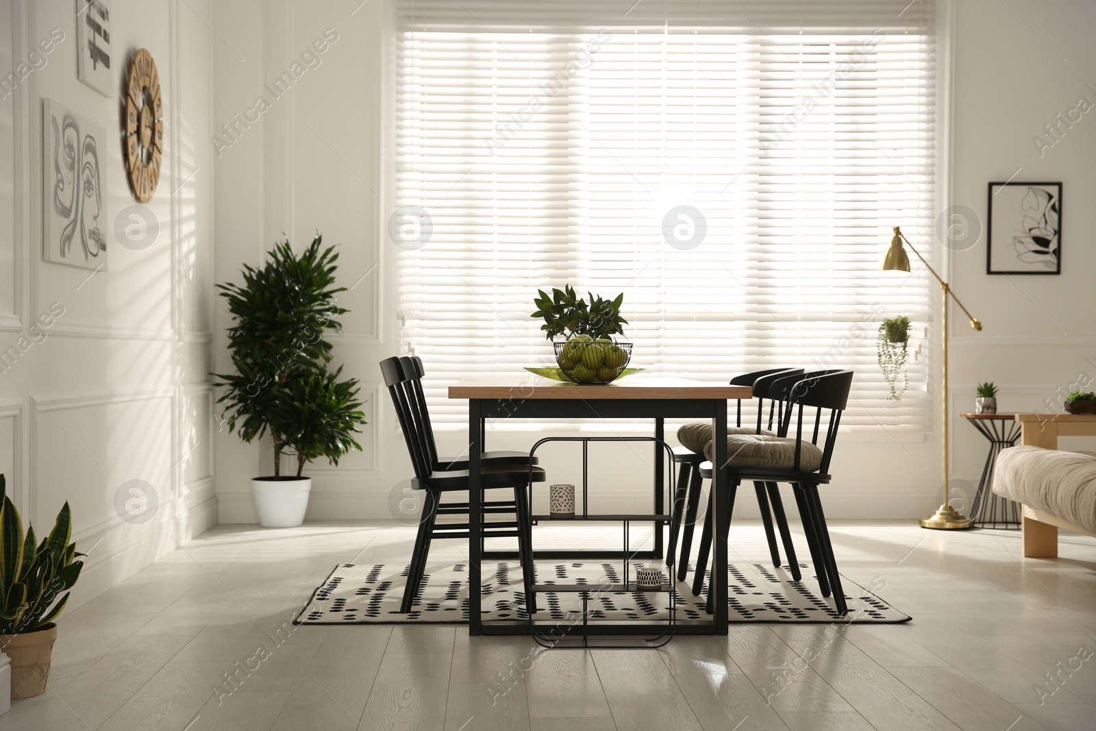 Photo of Stylish wooden dining table and chairs in room. Interior design