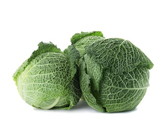 Photo of Fresh green savoy cabbages on white background