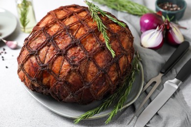 Photo of Delicious baked ham served on light grey table, closeup