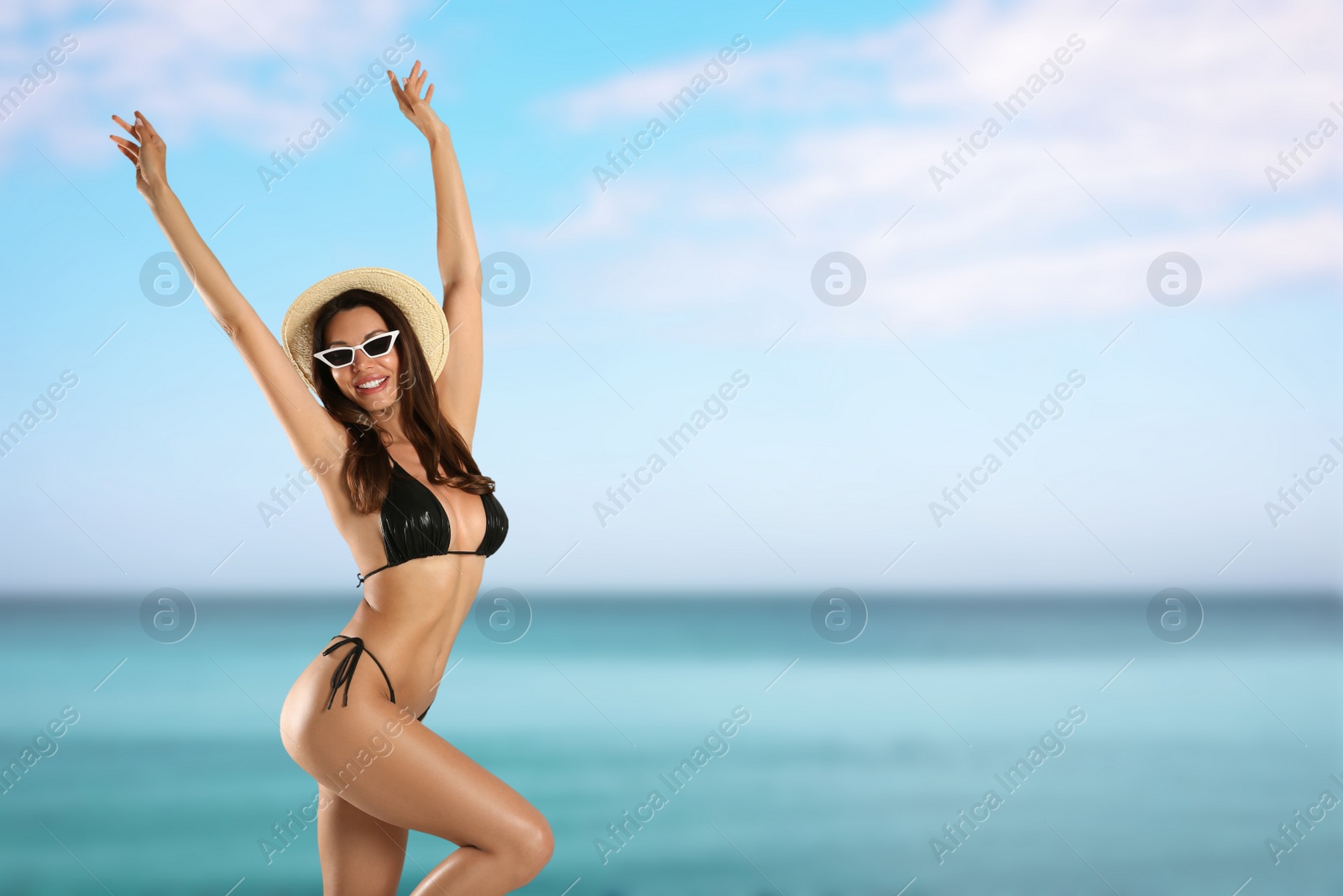 Image of Beautiful woman in stylish bikini on near sea, space for text