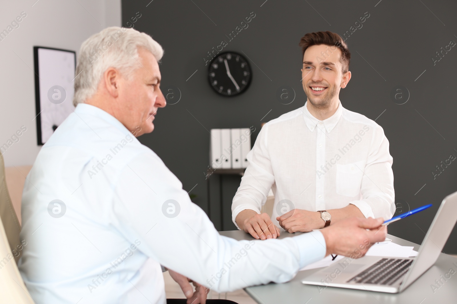 Photo of Human resources manager conducting job interview with applicant in office