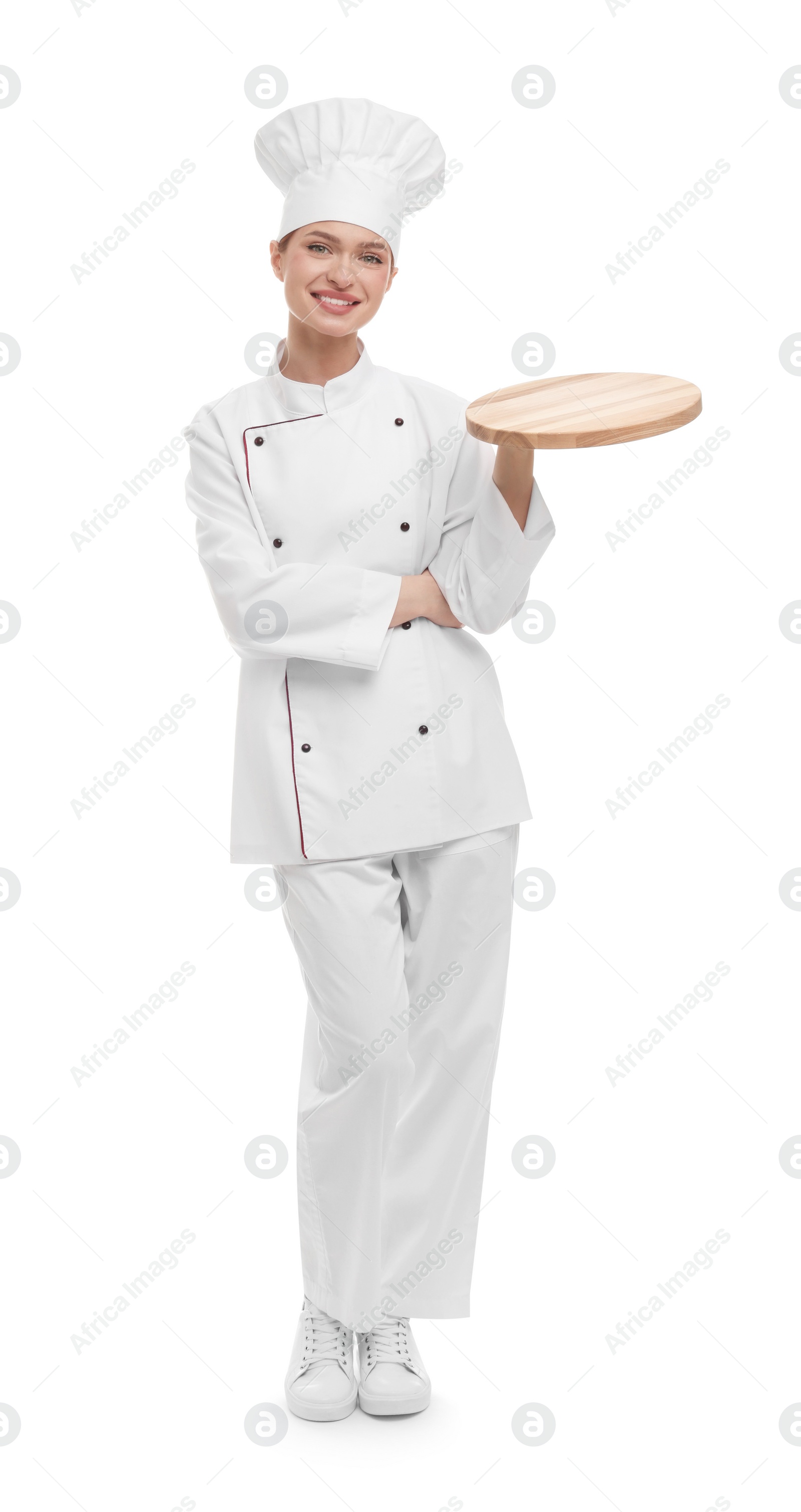 Photo of Happy chef in uniform holding empty wooden board on white background