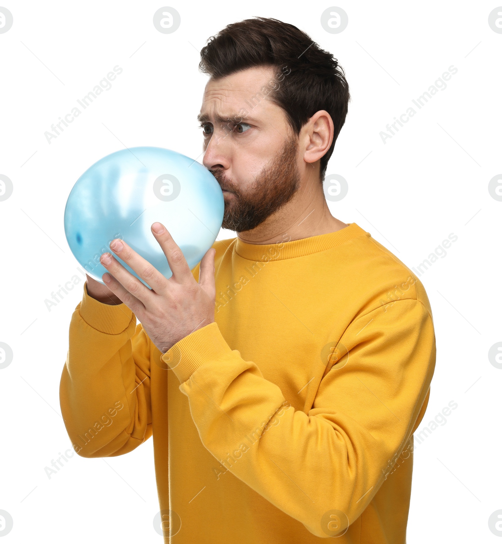 Photo of Man inflating light blue balloon on white background