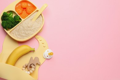 Photo of Healthy baby food and accessories on pink background, flat lay. Space for text