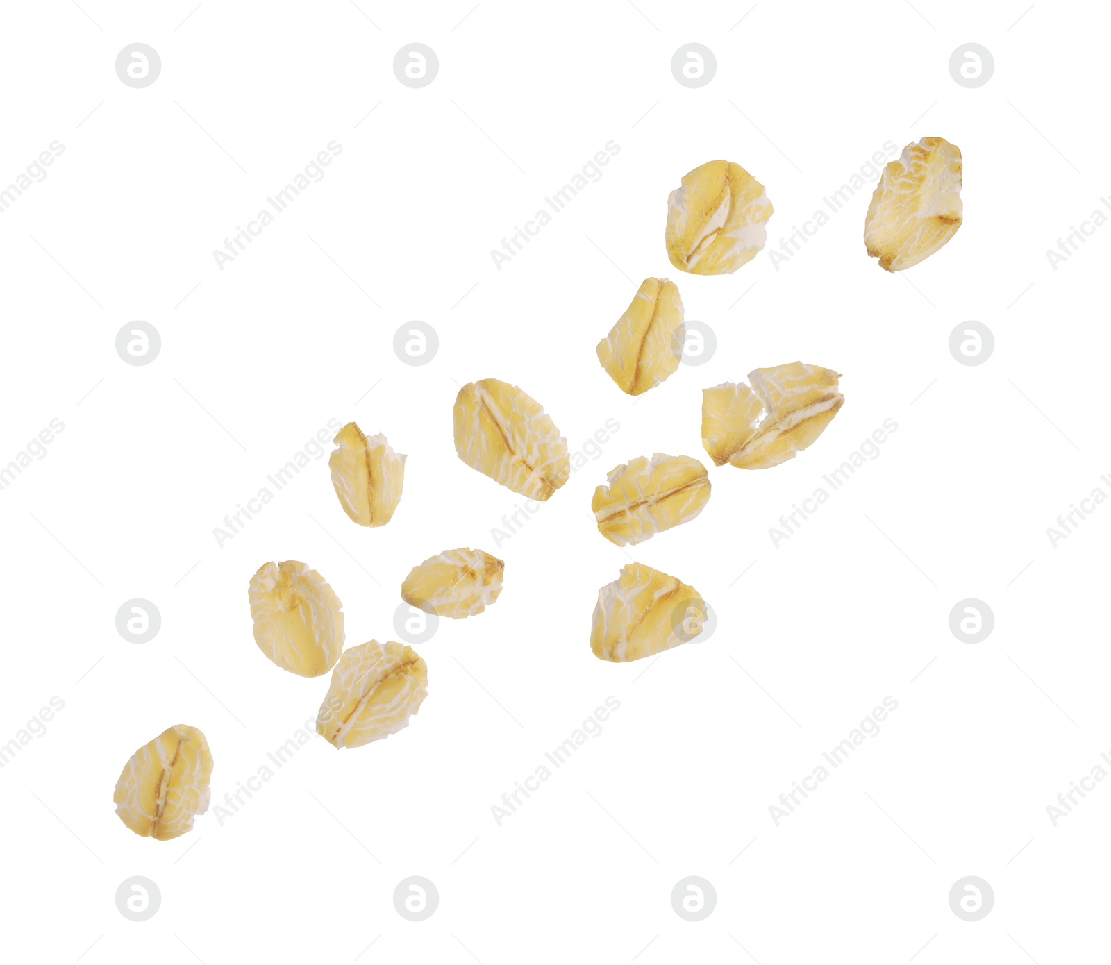 Photo of Dry oat flakes falling on white background