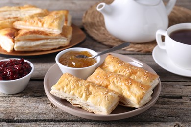 Delicious puff pastry served on wooden table