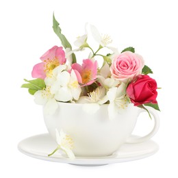 Photo of Aromatic herbal tea in cup with different flowers isolated on white