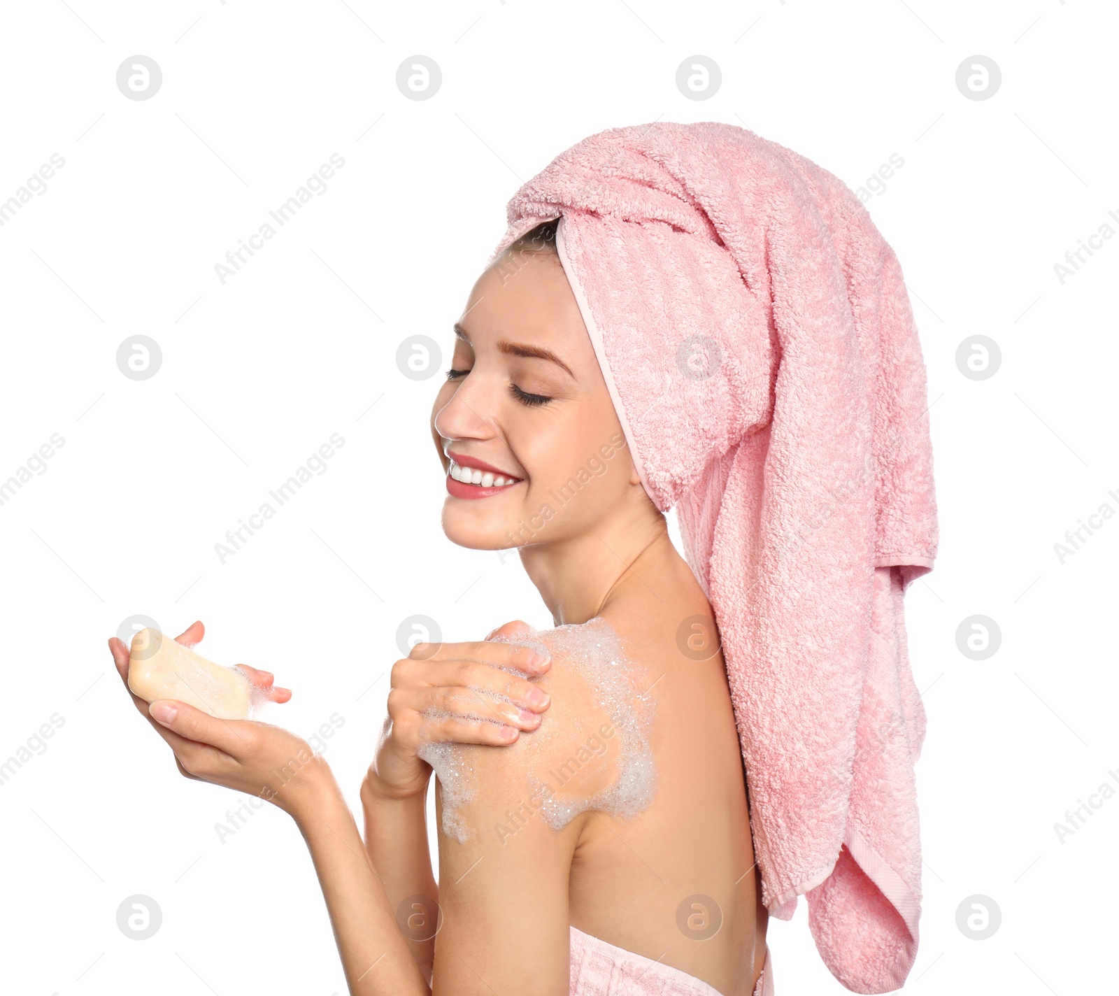 Image of Young woman washing body with soap bar on white background