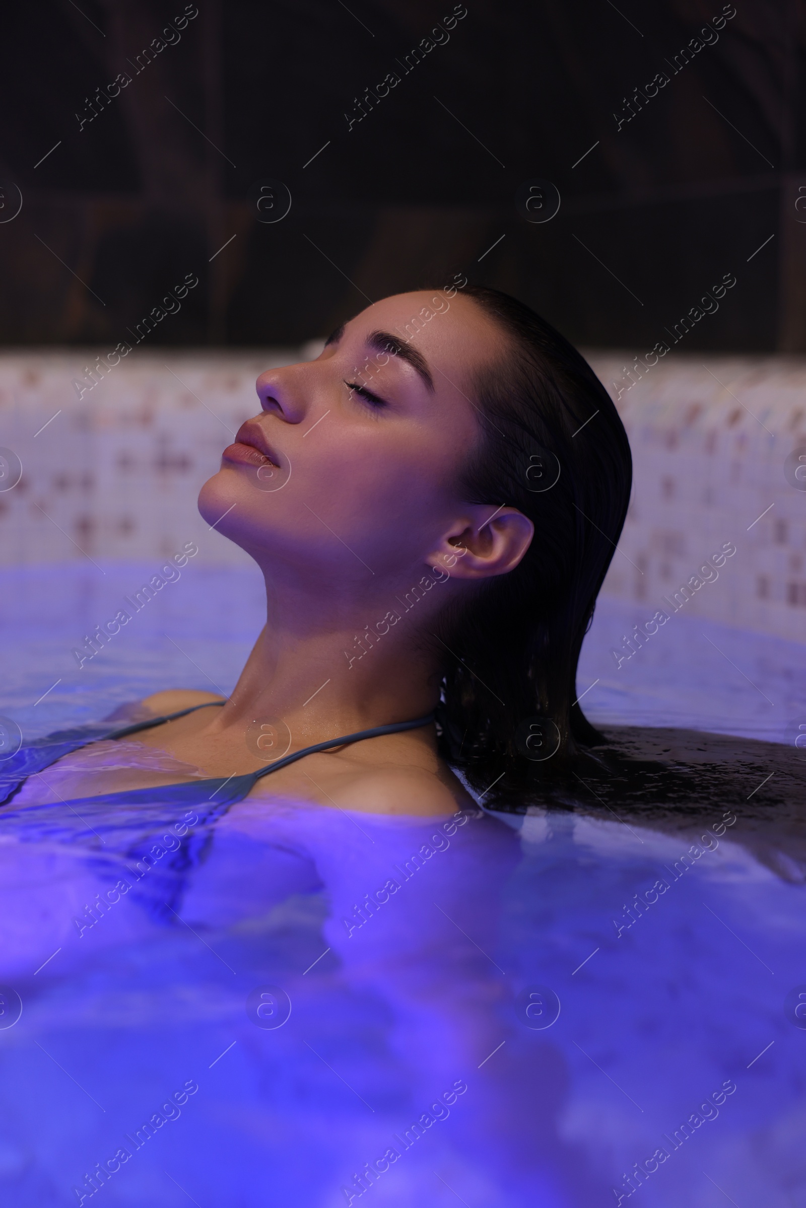 Photo of Beautiful woman relaxing in spa swimming pool