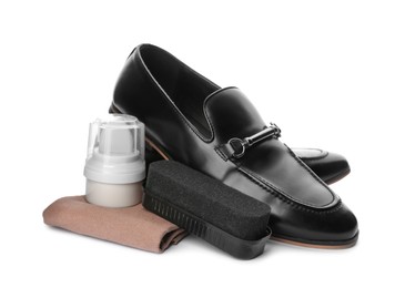 Photo of Stylish footwear and shoe care accessories on white background