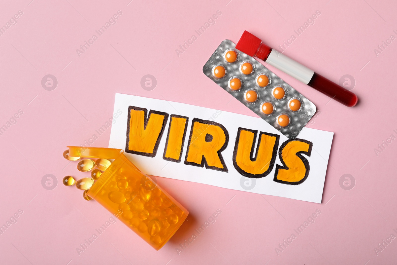 Photo of Flat lay composition with word VIRUS and medicines  on pink background