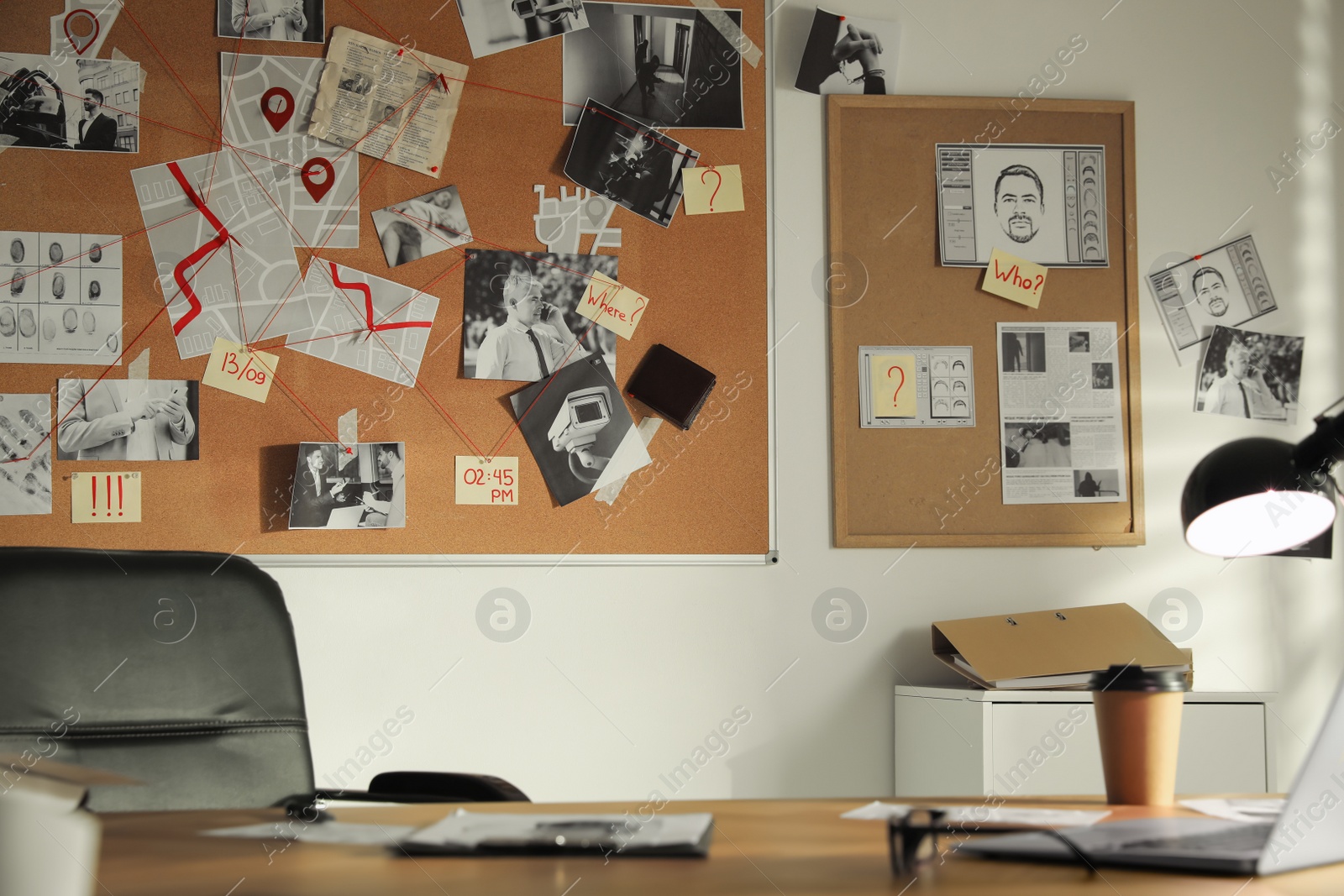 Photo of Detective office interior with big wooden desk and evidence board