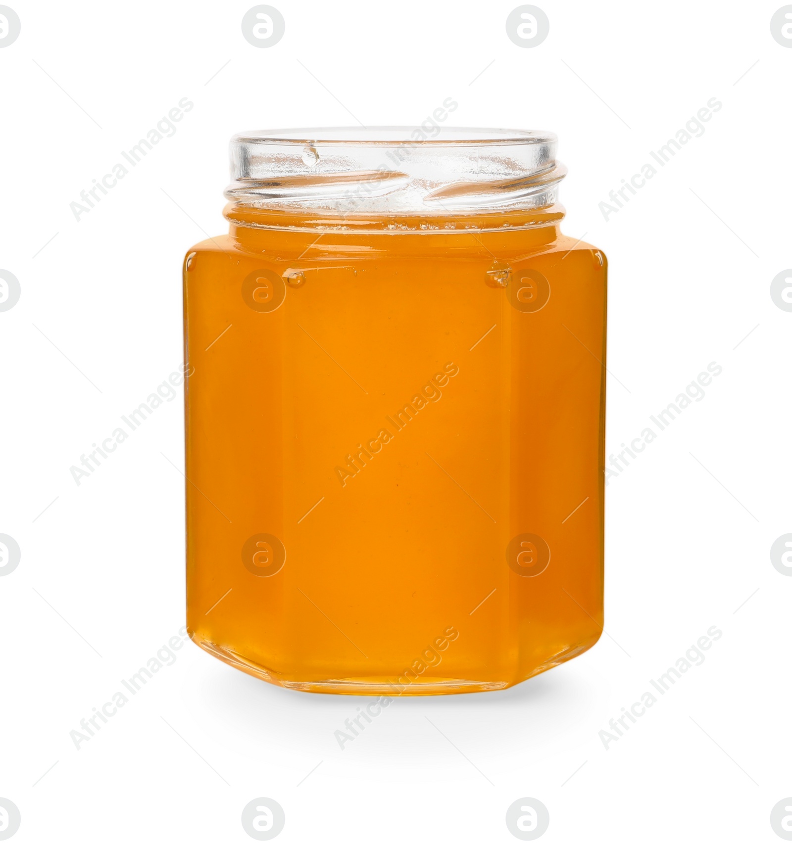 Photo of Tasty honey in glass jar isolated on white