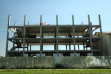Photo of Blurred view of unfinished building against blue sky
