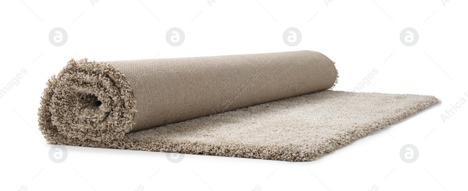 Photo of Rolled fuzzy carpet on white background. Interior element