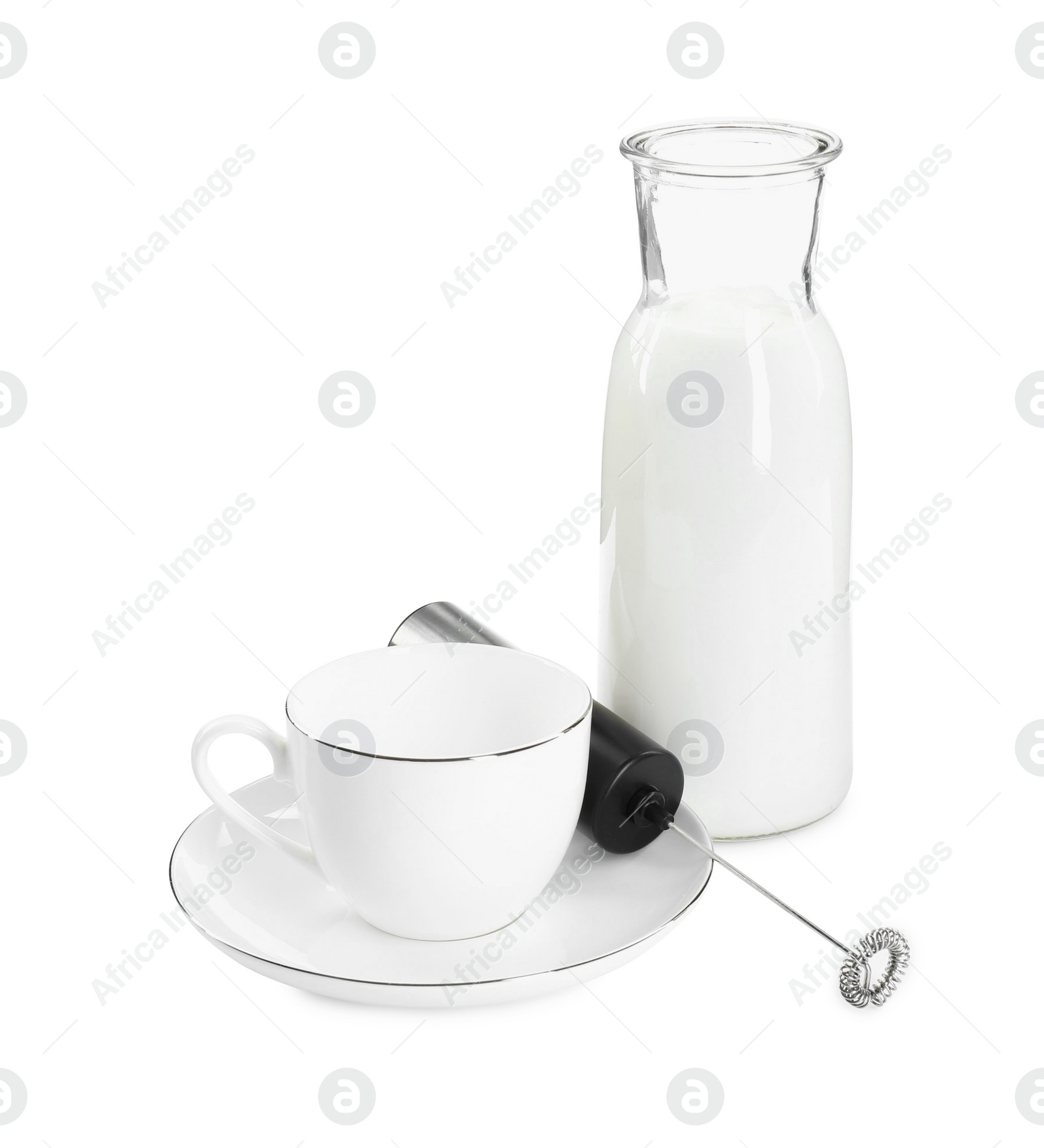 Photo of Milk frother wand, cup and glass carafe isolated on white