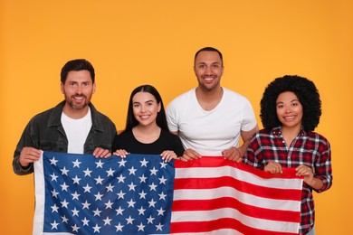 4th of July - Independence Day of USA. Happy friends with American flag on yellow background