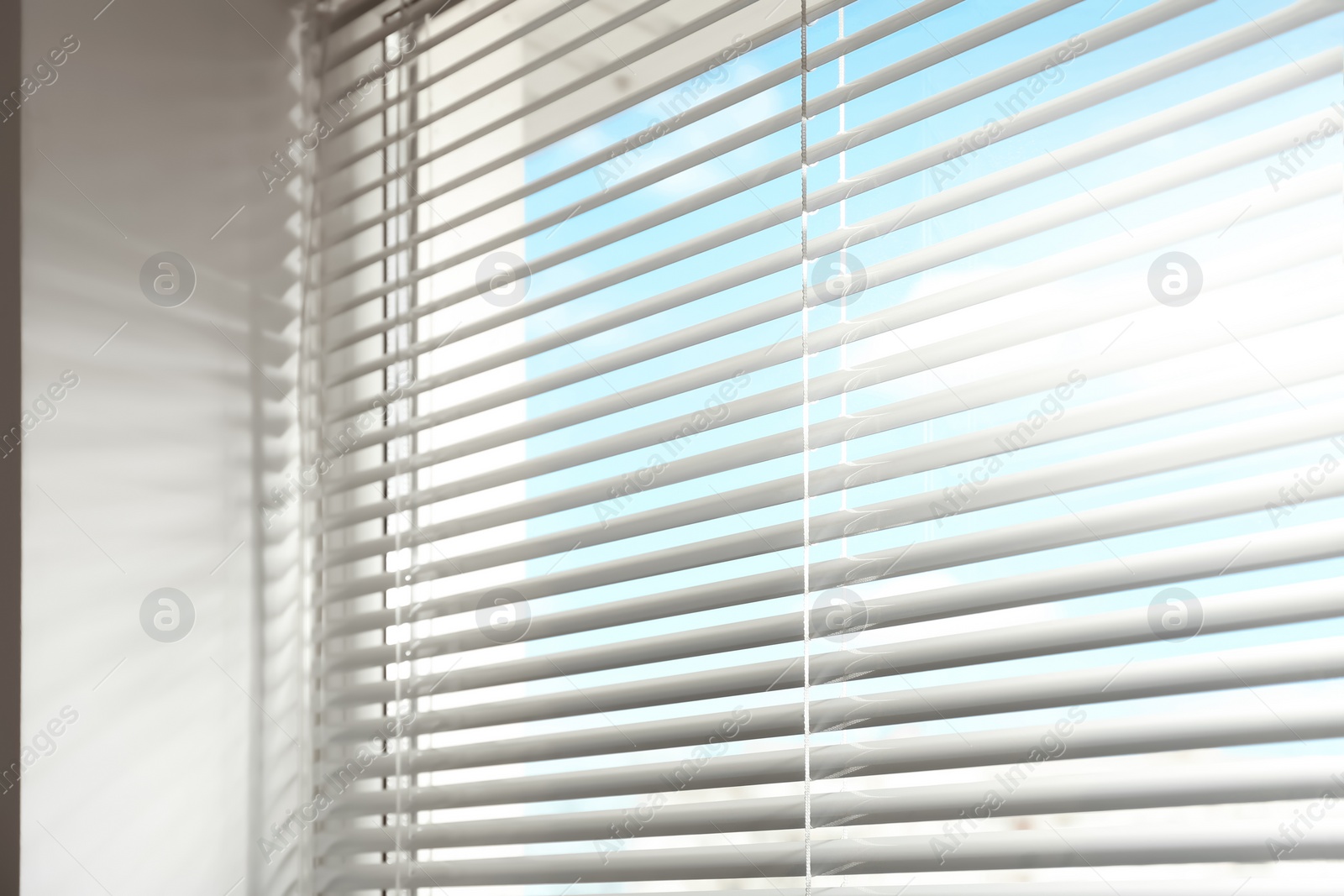 Photo of Closeup view of window with horizontal blinds