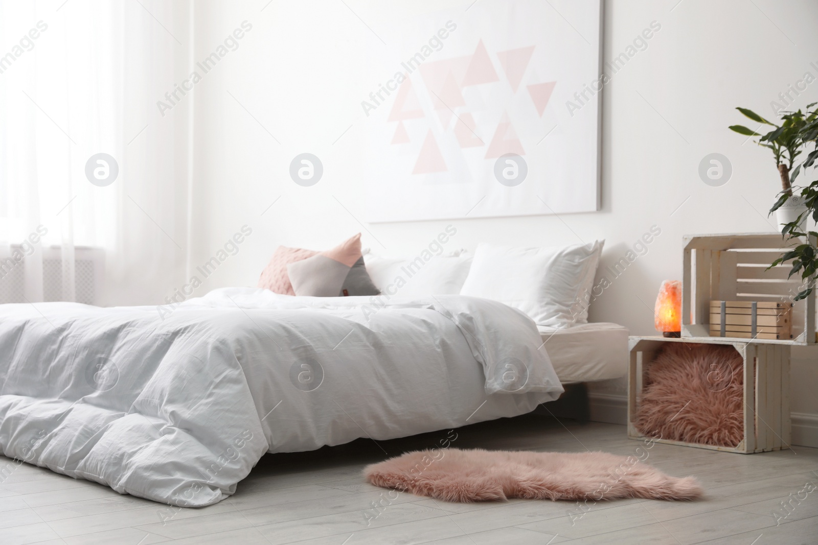 Photo of Light modern room interior with comfortable bed